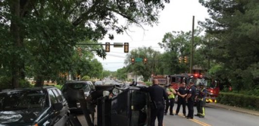 Car Flipped on Grady Ave., Road Closed